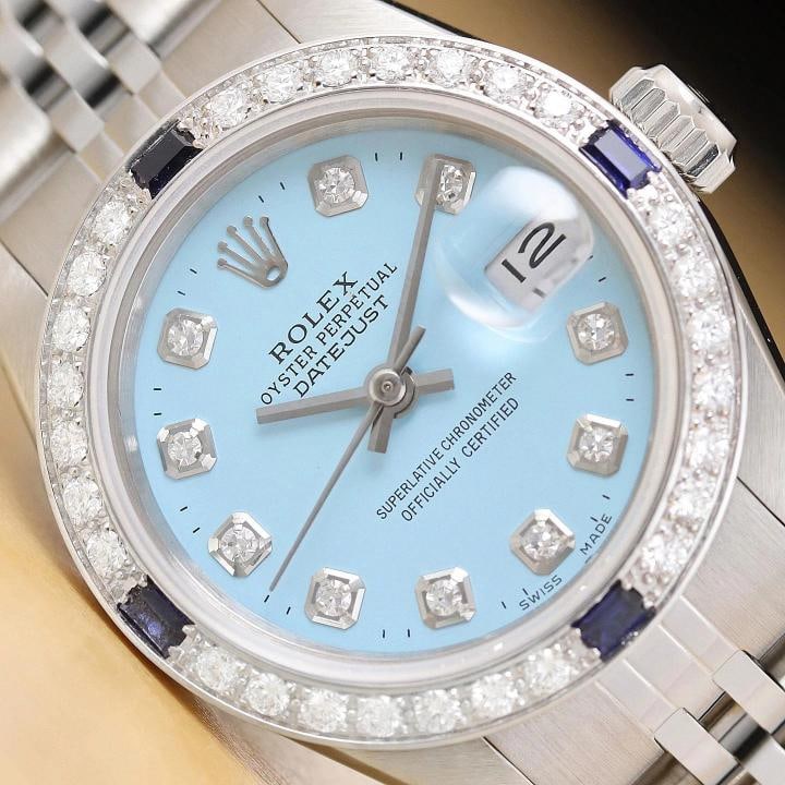 ROLEX LADIES DATEJUST 69174 AQUA BLUE DIAL 18K GOLD STEEL DIAMOND SAPPHIRE WATCH: This is an authentic Rolex Datejust 69174 watch with custom stainless steel jubilee bracelet, Rolex dial Ref. with added diamond markers, and custom 18K white gold diamond and sapphire bezel.