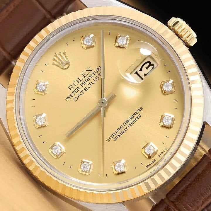 ROLEX MENS DATEJUST 16013 18K GOLD STEEL CHAMPAGNE DIAMOND BROWN LEATHER WATCH: This is an authentic Rolex Datejust 16013 watch with Rolex dial Ref. with added diamond markers, Rolex 18K yellow gold fluted bezel, and custom genuine brown leather strap. Descriptions: Brand: Rolex