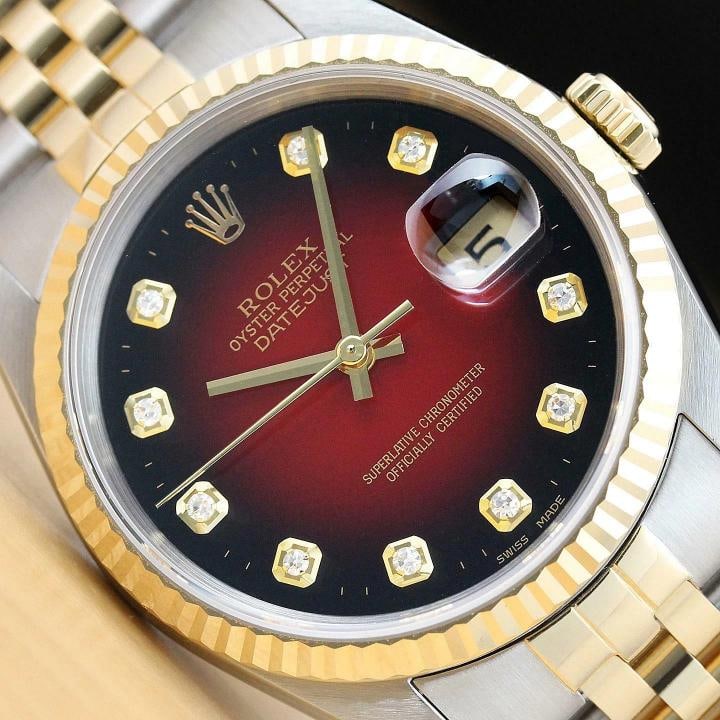 ROLEX MENS DATEJUST 16233 RED VIGNETTE DIAMOND 18K YELLOW GOLD STEEL WATCH: This is an authentic Rolex Datejust 16233 watch with Rolex two tone 18K yellow gold and stainless steel jubilee bracelet, Rolex dial Ref. with added genuine diamond markers, and Rolex 18K yellow gold