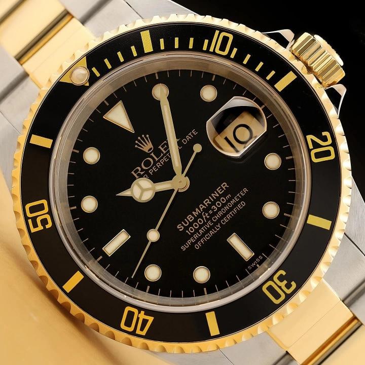 ROLEX SUBMARINER DATE 16613LN 18K GOLD BLACK 40MM STAINLESS STEEL WATCH w/ PAPER: Condition: Pre-owned - Excellent,Bezel Color: Black,Max Wrist Size: 7.26-7.5 in,Number of Jewels: 31 Jewels,Indices: Baton Indexes,Year Manufactured: 1990-1999,Gender: Men's,Bezel: Rotatable 18K Yello