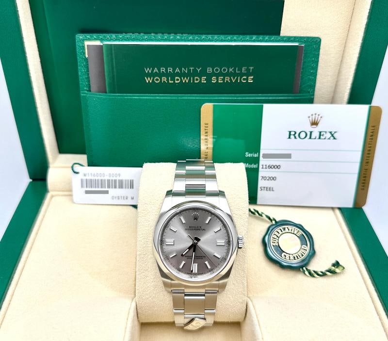 Rolex Oyster Perpetual 116000 DOMINO'S 36mm Silver Dial Steel Box Paper 2019: Style Number: 116000 Year: 2019 Model: Rolex Oyster Perpetual Case Material: Stainless Steel with Domino's Inscription Band: Stainless Steel with Domino's Emblem Bezel: Stainless Steel Dial: Steel