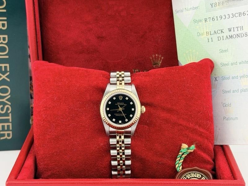 Rolex Ladies Oyster Perpetual 76193 Black Diamond Dial 18k Gold Steel Box Paper: Style Number: 76193 Serial: Y83**** Year: 2005 Model: Rolex Ladies Oyster Perpetual Case Material: Stainless Steel Band: 18k Yellow Gold & Stainless Steel Jubilee Bezel: 18k Yellow Gold Fluted Dial: