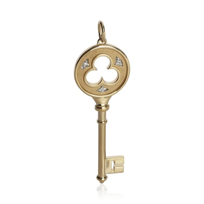 Tiffany & Co. Yellow Gold Diamond Clover Key Pendant: Condition: Pre-owned,Side Stone Type: Diamond,Side Stone Weight (cts): 0.02,Metal Purity: 18k,With Original Box/Packaging: No,With Papers: No,Gross Weight (grams): 8.62,Department: Unisex,Collection: 