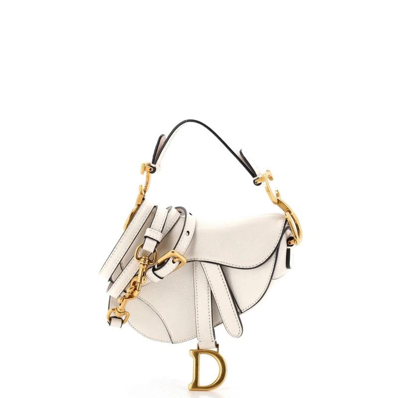 Christian Dior Saddle Handbag with Strap Leather Micro: Condition: Pre-owned - Good,Brand: Christian Dior,Exterior Material: Leather,Style: Shoulder Bags,Exterior Color: White,Department: Women,Size: Micro,Accessories: With Strap Condition: Very good.