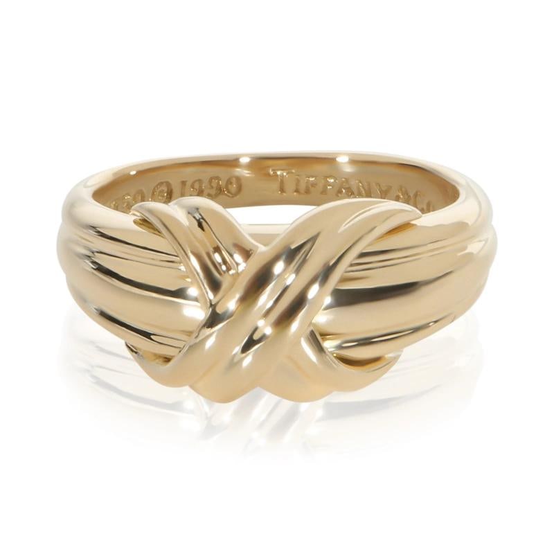 Tiffany & Co. Yellow Gold Signature X Ring: Condition: Pre-owned,Side Stone Type: No Stone,Metal Purity: 18k,With Original Box/Packaging: No,With Papers: No,Gross Weight (grams): 5.64,Department: Women's,Collection: Signature X,Type: Ring,Main