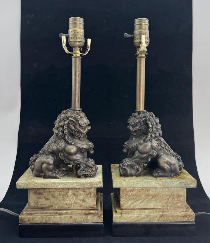 Pair of Chinese Bronze Foo Dog Lamps on Marble Base: Each foo dog sits atop a greenish yellow veined marble base, which in turn rests on a black base. The black base measures 7 inches by 4 3/4 inches. Each bronze foo dog measures approximately 6 inches