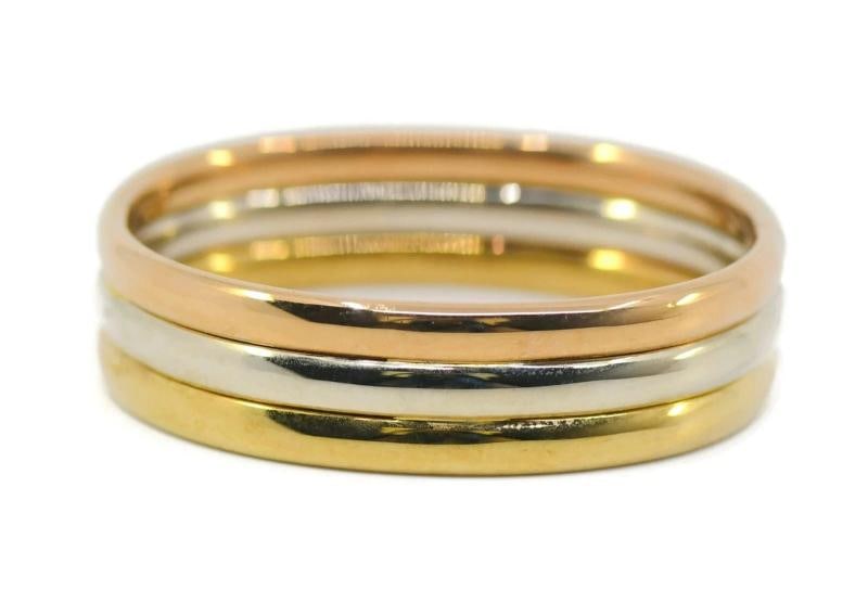 CARTIER Retro 18k Tri Color Gold Cuff Bangle Bracelet Retro 1950s Rare: Size Will fit up to 7" wrist 5/8" top to bottom Weight 49.4 grams. Condition: Pre-owned - Good: This item has been gently used but is in good condition. It might have a few signs ... Read moreabout