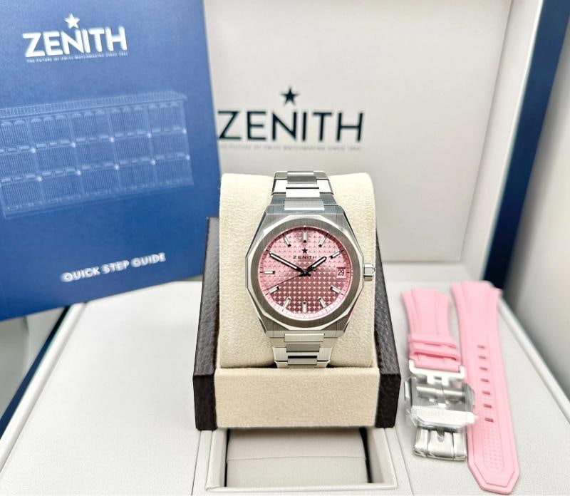 Zenith Defy Skyline Pink Dial 03.9400.670/18.I001 36mm Steel Box Booklet: Style Number: 03.9400.670/18.I001 Year: 2023 - Present Model: Zenith Defy Skyline 36 Case Material: Stainless Steel Band: Stainless Steel with additional Zenith Pink Rubber Strap Bezel: Stainless