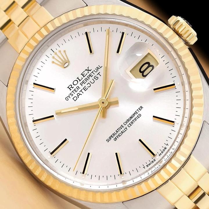 ROLEX MENS DATEJUST 16013 SILVER DIAL 18K YELLOW GOLD STAINLESS STEEL WATCH: This is an authentic Rolex Datejust 16013 watch with an original Rolex two tone 18K yellow gold and stainless steel jubilee bracelet, Rolex stick dial Ref., and Rolex 18K yellow gold fluted bezel.Desc