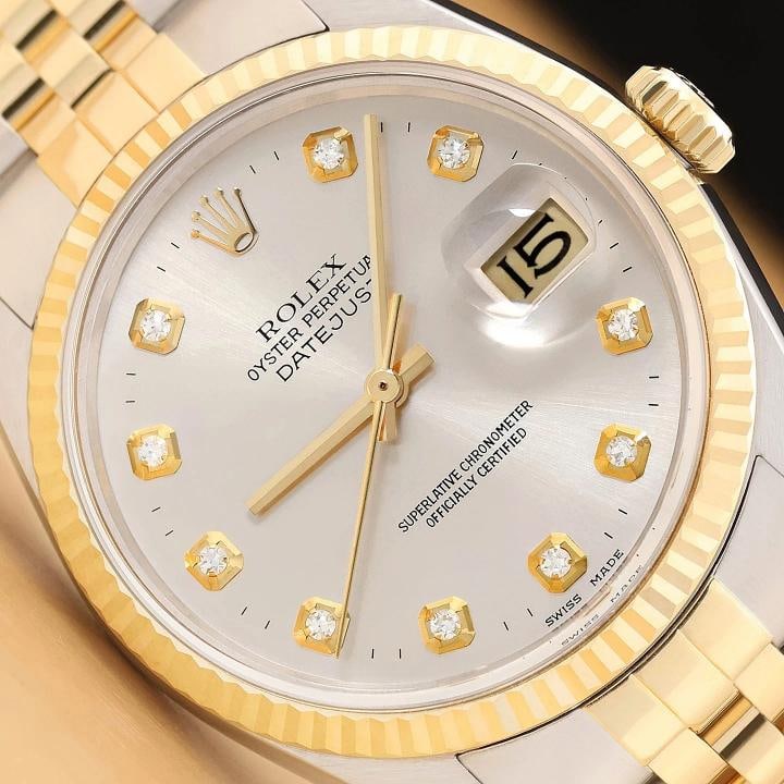 ROLEX MENS DATEJUST 16013 SILVER DIAMOND DIAL 18K YELLOW GOLD STEEL WATCH: This is an authentic Rolex 16013 watch with Rolex 18K yellow gold and stainless steel jubilee bracelet, Rolex dial Ref. with added genuine diamond markers, and Rolex 18K yellow gold fluted bezel. Desc