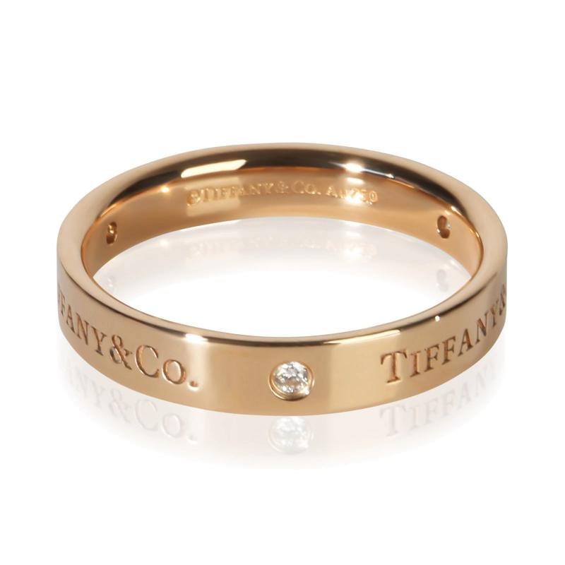 Tiffany & Co. Rose Gold Diamond T&Co. Band: Condition: Pre-owned,Shape: Round Brilliant,With Original Box/Packaging: Yes,Side Stone Type: Diamond,Side Stone Weight (cts): 0.09,Metal Purity: 18k,With Papers: No,Gross Weight (grams):
