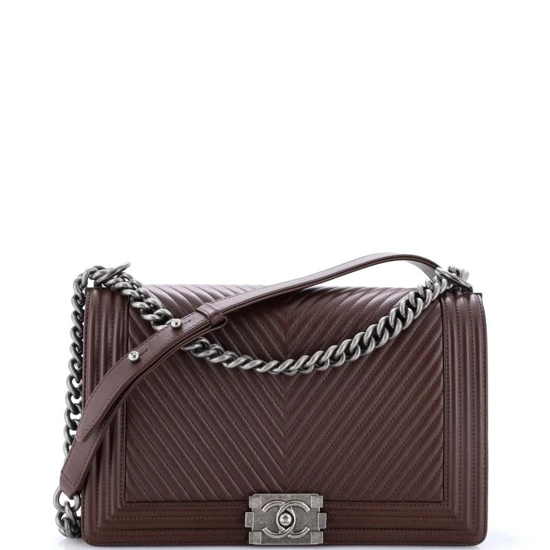 Chanel Boy Flap Bag Chevron Lambskin New Medium: Accessories: Authenticity Card, Dust Bag Measurements: Handle Drop 11", Height 7", Width 11", Depth 3", Strap Drop 20". Condition: Pre-owned - Good,Brand: Chanel,Exterior Material: Leather,Style: Shou