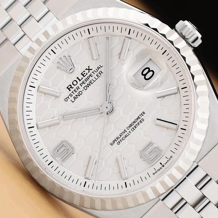 2026 APR B&P ROLEX LAND- DWELLER 127234 36MM 18K GOLD BEZEL HONEYCOMB WATCH: This is an authentic Rolex Land- Dweller 127234 36mm white honeycomb dial watch with 18K white gold fluted bezel, stainless steel flat jubilee bracelet, and Rolex warranty card. Descriptions: Brand: R