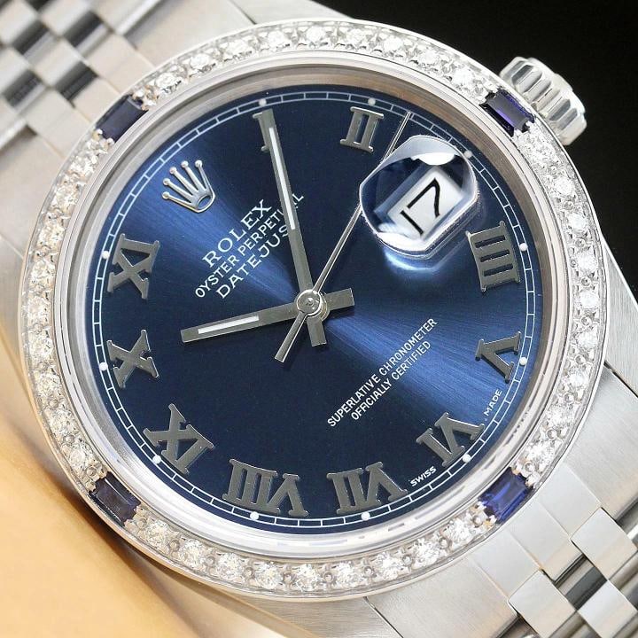 MENS ROLEX DATEJUST BLUE ROMAN DIAMOND SAPPHIRE 18K WHITE GOLD STEEL WATCH: Condition: Pre-owned - Excellent,Bezel Color: Silver,Max Wrist Size: 7.26-7.5 in,Number of Jewels: 27 Jewels,Indices: Roman Numerals, 12-Hour Dial,Bezel: Custom 18K White Gold Sapphire Diamond Bezel,B