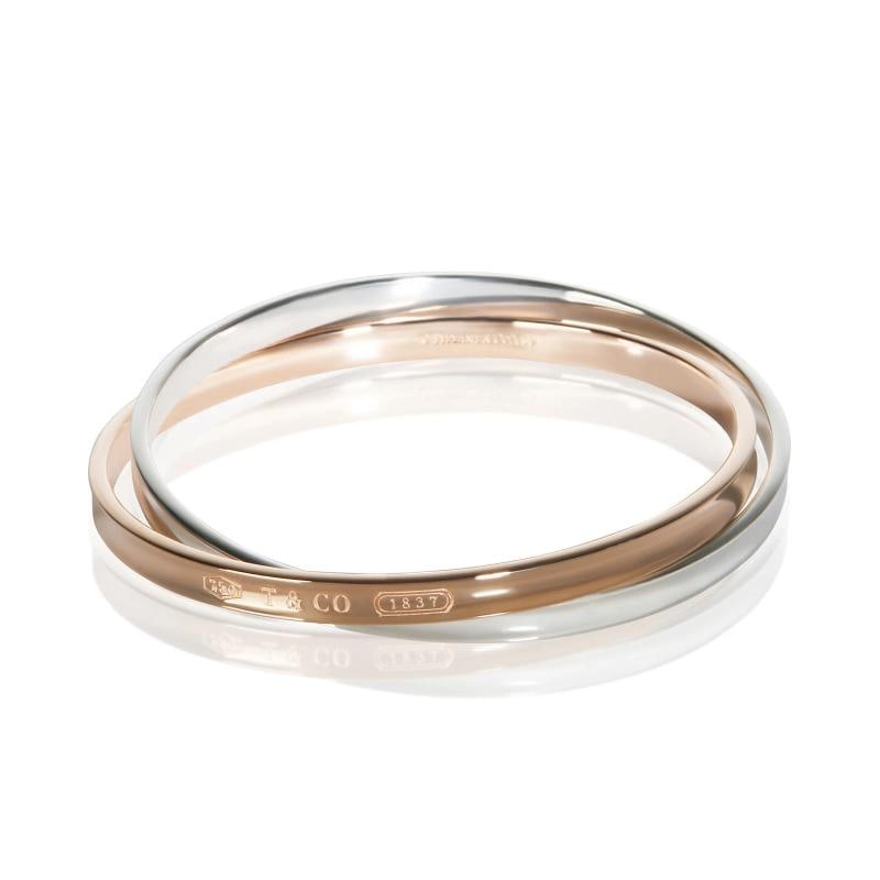 Tiffany & Co. Rose Gold & Sterling Silver 1837 Interlocking Bracelet: Condition: Pre-owned,Item Length: 7.5 in,Clasp/Buckle Type: No Clasp,Side Stone Type: No Stone,Metal Purity: 18k,With Original Box/Packaging: No,With Papers: No,Gross Weight (grams): 49.00,Department: