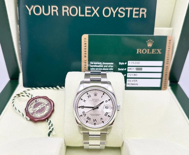Rolex Date 115200 34mm Silver Roman Dial Stainless Steel Box Papers: Style Number: 115200 Serial: M017*** Year: 2010 Model: Rolex Date Case Material: Stainless Steel Band: Stainless Steel Bezel: Stainless Steel Dial: Silver Roman Dial Crystal: Sapphire Crystal Case Siz