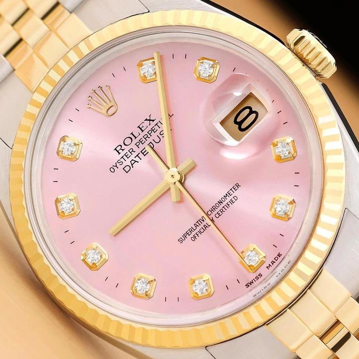 ROLEX MENS DATEJUST 16013 PINK DIAMOND 18K YELLOW GOLD STAINLESS STEEL WATCH: This is an authentic Rolex Datejust 16013 watch with Rolex two tone 18K yellow gold and stainless steel jubilee bracelet, Rolex dial Ref. with added diamond markers, and Rolex 18K yellow gold fluted b