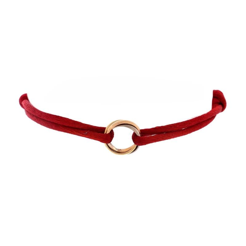 Cartier Trinity On Cord Bracelet Silk Cord with 18K Tricolor Gold: Condition: Pre-owned - Good,Brand: Cartier,Main Stone: Unknown,Metal: 18K Tri Colored Gold,Metal Purity: 18K,Style: Bracelet,Type: Bracelet,Color: Tricolor Gold,Material: 18K Rose Gold, 18K White Gold