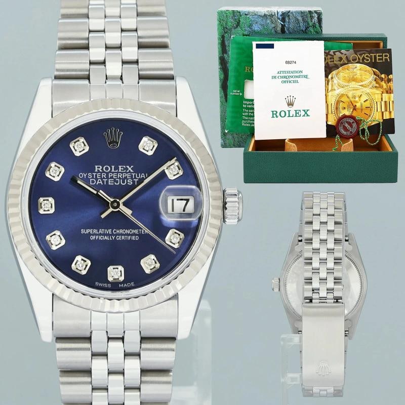 PAPERS Blue Diamond Ladies Rolex Midsize 31mm Datejust Jubilee Steel 68274 Watch: Case & Dial Case Material: Rolex Stainless Steel Case Size: 31mm Bezel: Rolex White Gold Fluted Crystal: Rolex Sapphire Dial: Custom Blue Diamond Movement & Bracelet Movement: Rolex Automatic Bracelet