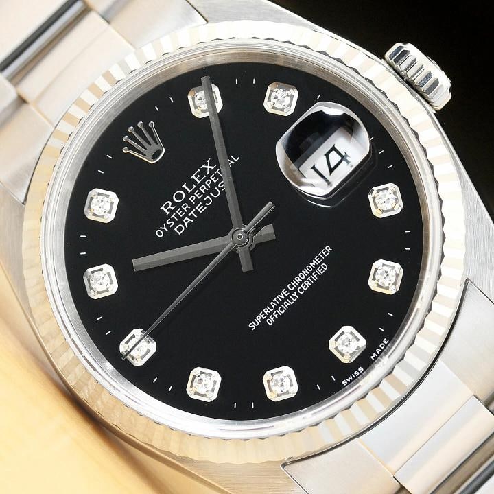 MENS ROLEX DATEJUST 16234 BLACK DIAMOND DIAL 18K WHITE GOLD STEEL OYSTER WATCH: This is an authentic Rolex Datejust 16234 watch with Rolex 18K white gold fluted bezel, Rolex dial Ref. with added diamond hour markers, and custom stainless steel oyster bracelet. Descriptions: Brand