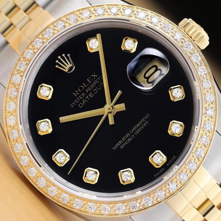 ROLEX DATEJUST 16233 BLACK FACTORY DIAMOND 18K YELLOW GOLD STEEL TWO TONE WATCH: This is an authentic Rolex Datejust 16233 watch with a two tone 18K yellow gold and stainless steel jubilee bracelet, factory Rolex diamond dial Ref., and custom 18K yellow gold diamond bezel. Descrip