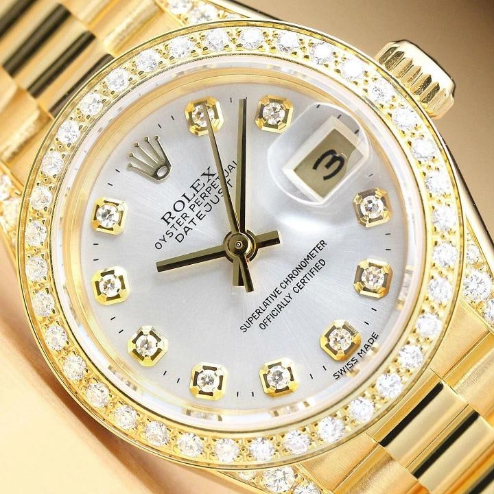 ROLEX LADIES PRESIDENT 69178 SILVER DIAL DIAMOND BEZEL & LUGS 18K GOLD WATCH: This is an authentic Rolex Datejust 69178 watch with 18K yellow gold president bracelet, Rolex dial Ref. with added diamond hour markers, custom 18K yellow gold diamond bezel, added diamonds on the lu