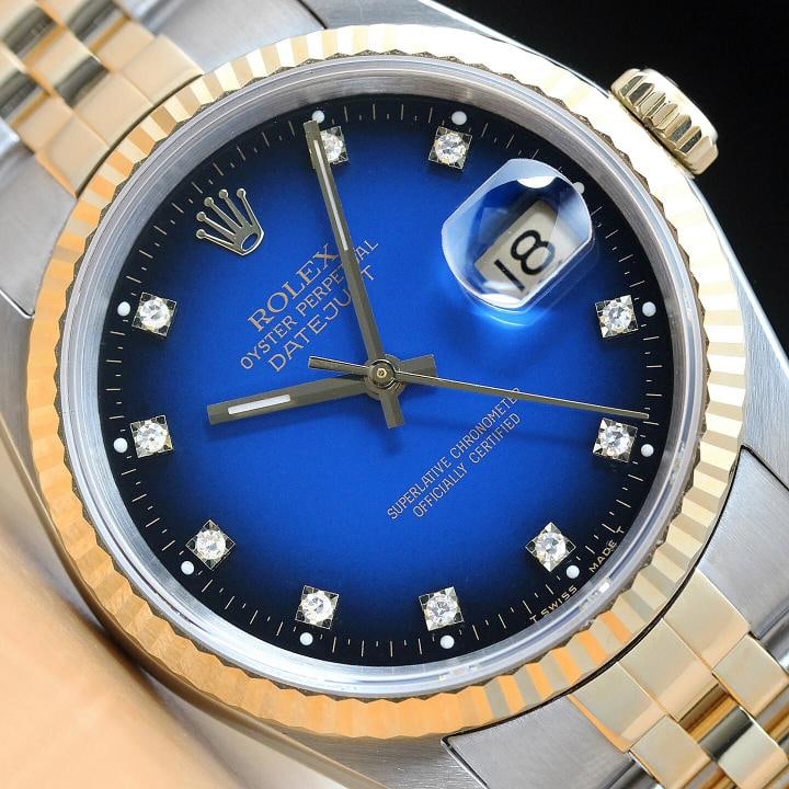 ROLEX MENS DATEJUST BLUE VIGNETTE FACTORY DIAMOND 18K YELLOW GOLD STEEL WATCH: This is an authentic Rolex Datejust 16233 watch with Rolex 18K yellow gold and stainless steel jubilee bracelet, factory Rolex diamond dial Ref., and Rolex 18K yellow gold fluted bezel.Descriptions: B