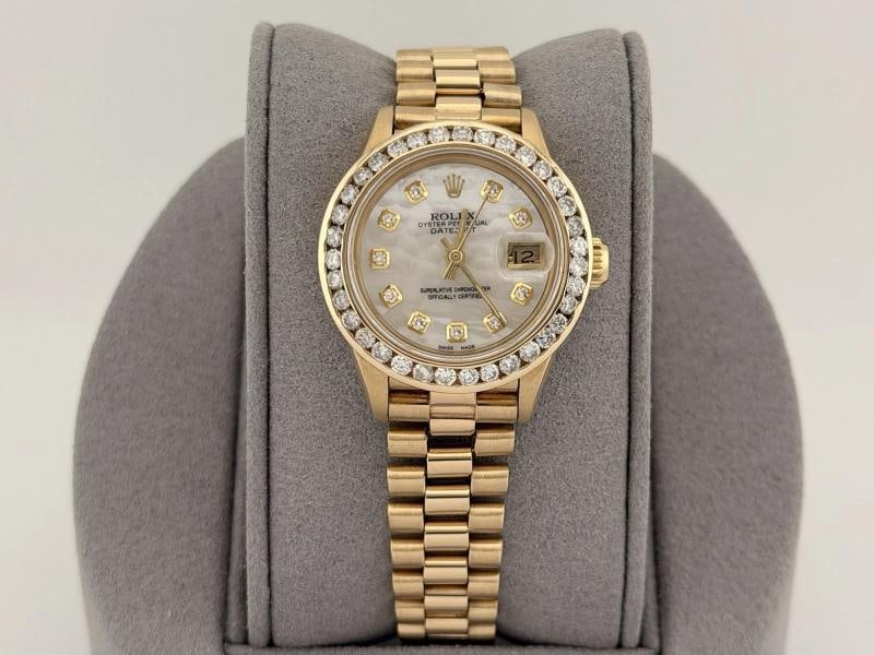 Rolex Ladies President Datejust 69178 Diamond Bezel MOP Diamond Dial 18k Gold: Condition: Pre-owned - Excellent,Bezel Color: Gold, Yellow,Movement: Mechanical (Automatic),Seller Warranty: Yes,Indices: Diamond Markers,Year Manufactured: 1980-1989,Band/Strap: Rolex President,Refer