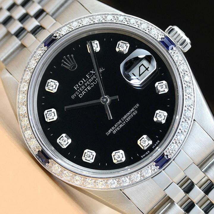 MENS ROLEX DATEJUST 16014 BLACK DIAMOND SAPPHIRE 18K WHITE GOLD STEEL WATCH: This is an authentic Rolex Datejust 16014 watch with Rolex stainless steel jubilee bracelet, Rolex dial Ref. with diamond markers, and custom 18K white gold diamond and sapphire bezel. Descriptions: B