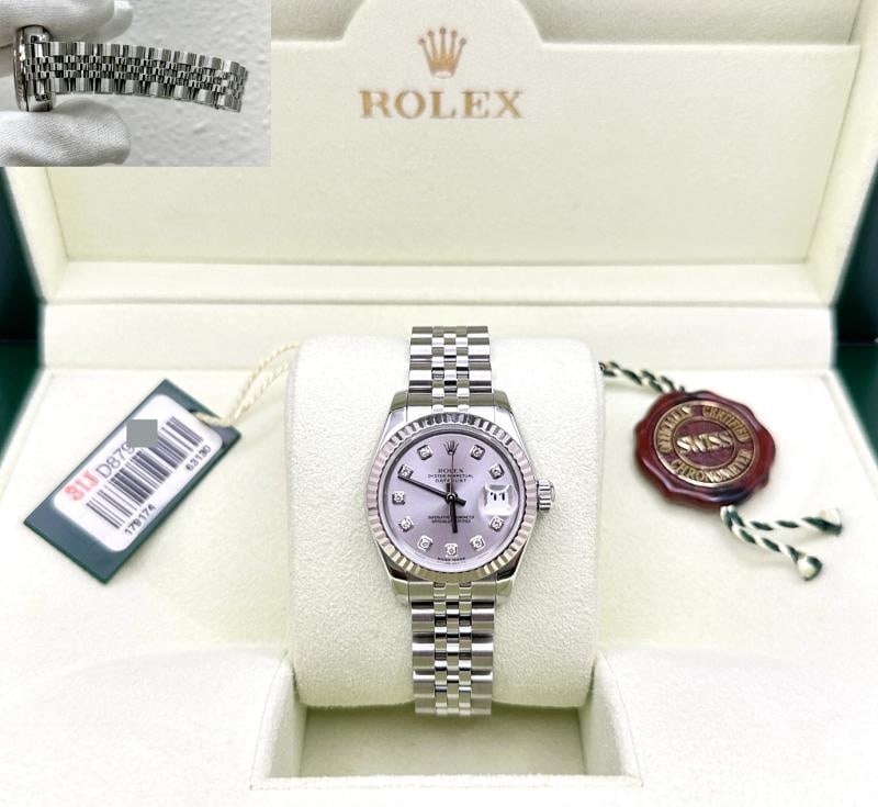 Rolex Ladies Datejust 179174 26mm Silver Diamond Dial 18k Gold Steel Box Tags: Style Number: 179174 Serial: D879**** Year: 2005 Model: Rolex Ladies Datejust Case Material: Stainless Steel Band: Stainless Steel Bezel: 18k White Gold Fluted Dial: Factory Silver Diamond Dial Crysta