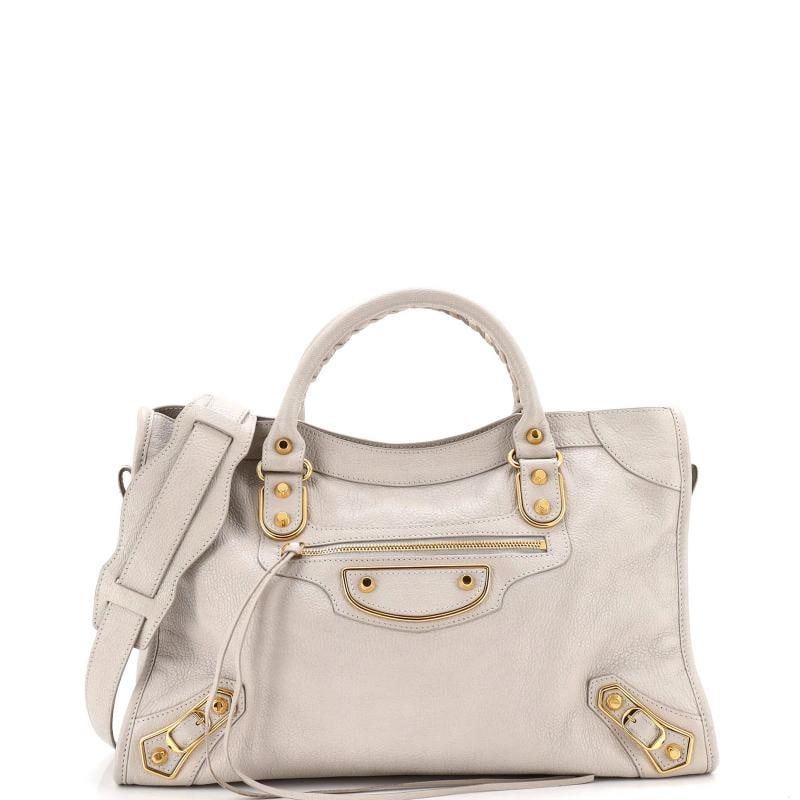 Balenciaga City Classic Metallic Edge Bag Leather Medium: Accessories: With Strap Measurements: Handle Drop 5", Height 10", Width 15", Depth 5", Strap Drop 9" . Condition: Pre-owned - Good,Brand: Balenciaga,Exterior Material: Leather,Style: