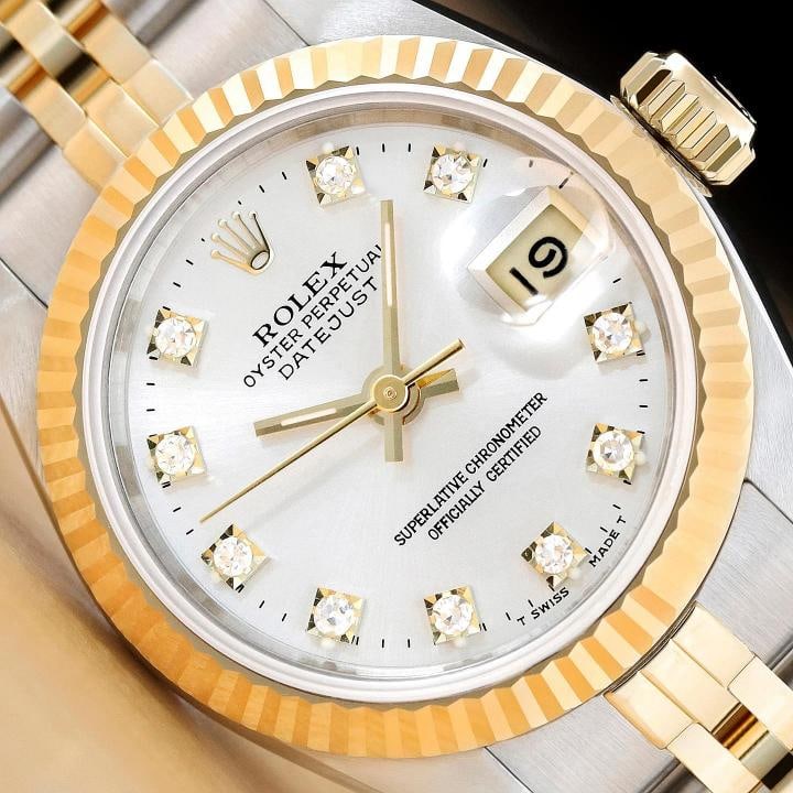 ROLEX LADIES DATEJUST 69173 SILVER FACTORY DIAMOND DIAL 18K GOLD STEEL WATCH: This is an authentic Rolex Datejust 69173 watch with Rolex 18K yellow gold and stainless steel jubilee bracelet, factory Rolex diamond dial Ref., and Rolex 18K yellow gold fluted bezel. Descriptions: 