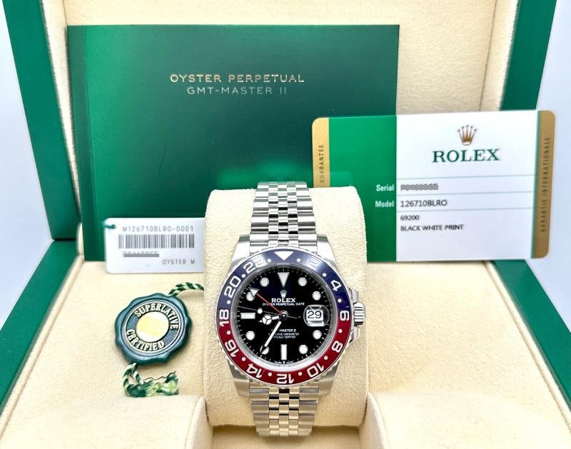 Rolex GMT Master II Pepsi 126710BLRO 40mm Red Blue Bezel Steel Jubilee Box Paper: Style Number: 126710BLRO Year: 2020 Model: Rolex GMT Master II 'Pepsi' Case Material: Stainless Steel Band: Stainless Steel Jubilee Bezel: Pepsi - Blue & Red Ceramic. bezel insert has wear near 14