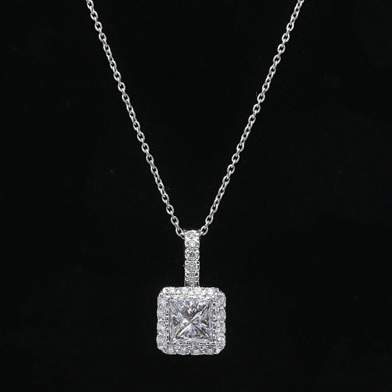 Princess Cut Diamond Pendant Necklace Halo Design in 14k White Gold: Length: 16 Inches Pendant: 1/2 X 1/4 Inches Center Diamond Shape: Princess Cut Diamond Clarity Enhanced Accent Diamonds: 21 Round Diamonds . Condition: Pre-owned - Excellent: This item has been