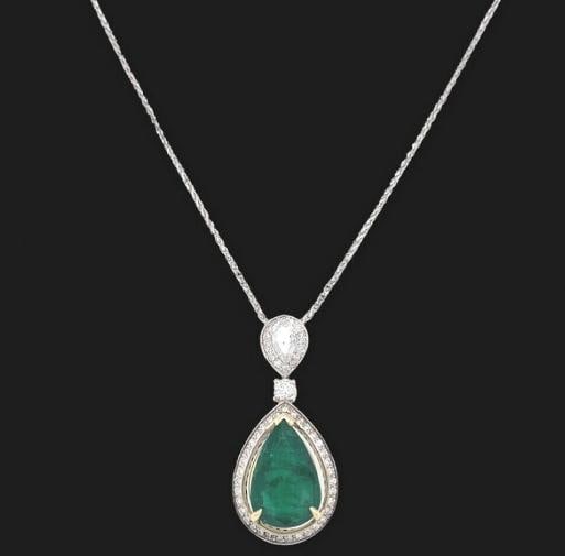 Emerald and Diamond Tear Drop Pendant Necklace 14kt White Gold: Length: 16' Inch Basket Weave Chain Pendant: 1.5' Inches Main Gemstone: ~3.70 cts Pear Shape Green Emerald Color & Clarity: Medium-Dark Green 16.20 X 10.69 X 4.85 MM Accent Diamonds: Pear Shape