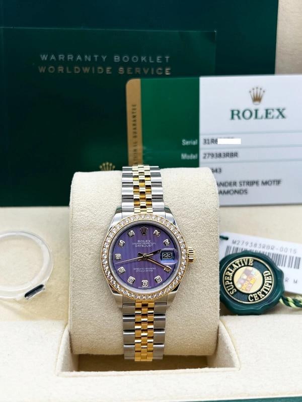 Rolex Datejust 279383RBR Diamond Bezel Lavander Dial 18K Gold Steel Box Paper: Style Number: 279383RBR Serial: 31R69*** Year: 2017 Model: Rolex Ladies Datejust Case Material: Stainless Steel Band: 18K Yellow Gold & Stainless Steel Bezel: Factory Diamond Bezel Dial: Factory Lavan