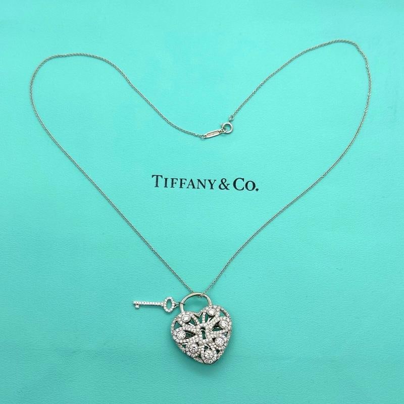 Tiffany & Co Large Filigree Heart Key Diamond Pendant Necklace 18K White Gold: Condition: Pre-owned - Excellent,Pendant Shape: Heart,Main Stone Creation: Natural,Closure: Spring Ring,Color: White,Main Stone Color: White/Colorless,Metal: White Gold,Secondary Stone: Diamond,Neckla