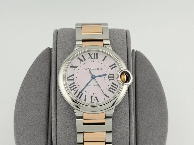 Cartier Ballon Bleu W6920033 3284 36mm Pink Mother Of Pearl Dial 18k Gold Steel: Condition: Pre-owned - Excellent,Bezel Color: Silver,Movement: Mechanical (Automatic),Seller Warranty: Yes,Dial Pattern: Mother of Pearl,Indices: Roman Numerals,Band/Strap: Bracelet,Reference Number: 