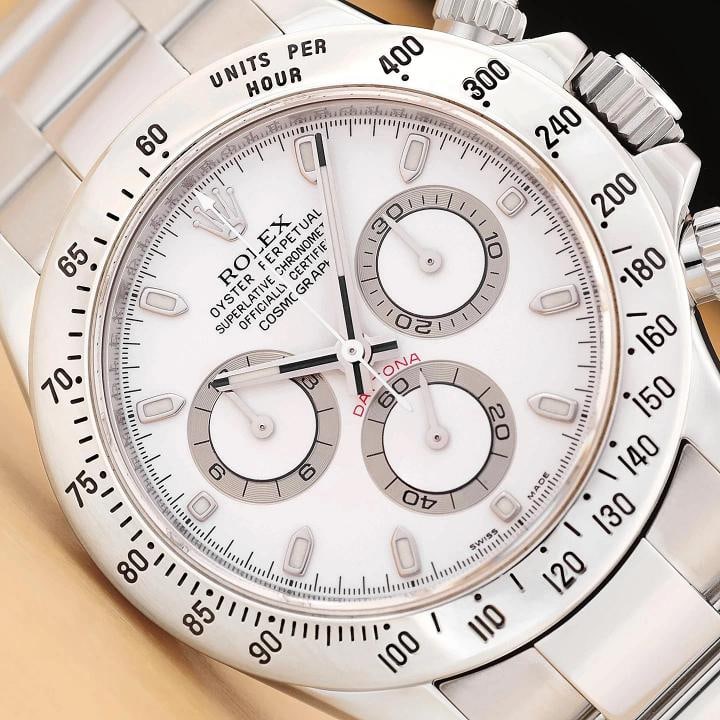 2010 CARD ROLEX DAYTONA COSMOGRAPH 116520 40MM WHITE OYSTER STEEL WATCH: This is an authentic Rolex Daytona Cosmograph 116520 40mm chronograph white dial watch with stainless steel bezel and stainless steel oyster bracelet. Descriptions: Brand: Rolex Model: Daytona Referen