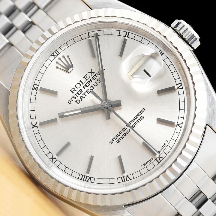 ROLEX MENS DATEJUST 16234 SILVER DIAL 18K WHITE GOLD STAINLESS STEEL WATCH: This is an authentic Rolex Datejust 16234 watch with original Rolex stick dial, Rolex 18K white gold fluted bezel, and Rolex stainless steel jubilee band.Descriptions: Brand: Rolex Model: Datejust Ref