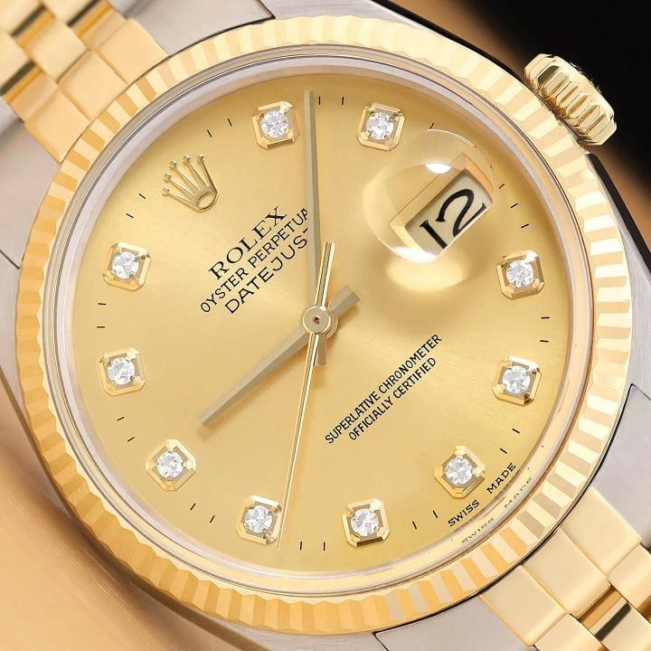 ROLEX MENS DATEJUST TWO TONE 18K YELLOW GOLD STEEL QUICKSET WATCH w/ ROLEX BAND: This is an authentic Rolex Datejust 16013 watch with Rolex 18K yellow gold and stainless steel jubilee bracelet, Rolex dial Ref. with added genuine diamond markers, and Rolex 18K yellow gold fluted be