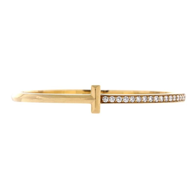 Tiffany & Co. T1 Hinged Bangle Bracelet 18K Yellow Gold and Diamonds Narrow: Measurements: Circumference: 5.75 ", Width: 9 mm . Condition: Pre-owned - Good,Brand: Tiffany & Co.,Main Stone: Diamond,Metal: 18K Yellow Gold,Metal Purity: 18K,Style: Bangle,Type: Bracelet,Color: Yel