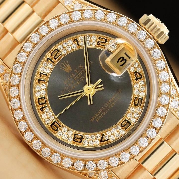 ROLEX LADIES PRESIDENT 69158 18K GOLD GRAY ARABIC FACTORY MYRIAD DIAMOND WATCH: This is an authentic Rolex Datejust 69158 watch with Rolex 18K yellow gold president bracelet, Rolex factory arabic myriad diamond dial and factory diamonds on the lugs, Rolex 18K yellow gold diamond 