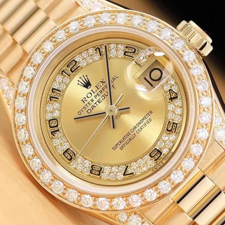 ROLEX PRESIDENT 69178 CHAMPAGNE ARABIC FACTORY MYRIAD DIAMOND 18K GOLD WATCH: This is an authentic Rolex Datejust 69178 watch with Rolex 18K yellow gold president bracelet, Rolex factory arabic myriad diamond dial, custom 18K yellow gold diamond bezel, added diamonds on the lug