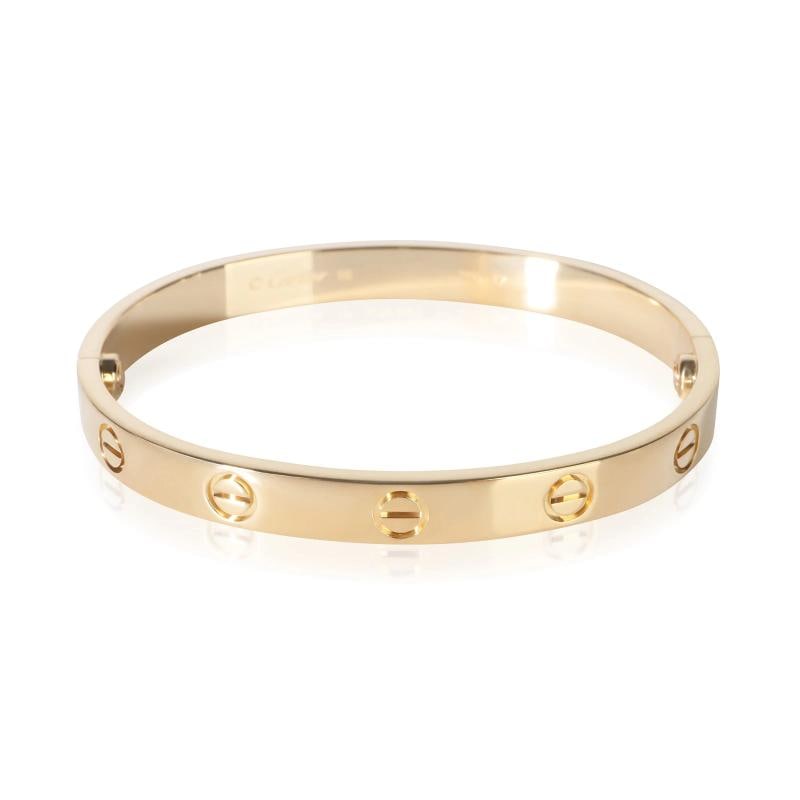 Cartier Yellow Gold Love Bracelet: Condition: Pre-owned,Item Length: 16 cm,Clasp/Buckle Type: Screw,With Original Box/Packaging: Yes,With Papers: Yes,Side Stone Type: No Stone,Metal Purity: 18k,Gross Weight (grams): 31.10,Department: