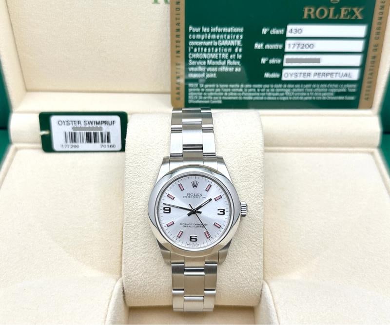 Rolex Oyster Perpetual Midsize 177200 31mm Silver and Pink Dial Steel Box Paper: . Condition: Pre-owned - Excellent,Bezel Color: Silver,Year Manufactured: 2010-2019,Band/Strap: Rolex Oyster,Case Color: Silver,Department: Women,Bezel Type: Smooth,Watch Shape: Round,Style: Casual,