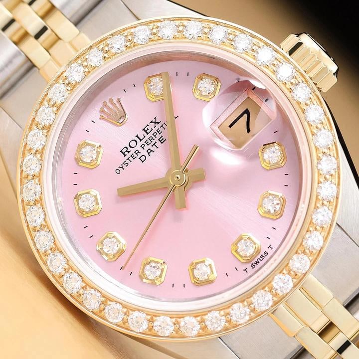 ROLEX LADIES DATE 6917 PINK DIAMOND 14K YELLOW GOLD STAINLESS STEEL 2-TONE WATCH: This is an authentic Rolex Date 6917 watch with Rolex 14K yellow gold and stainless steel jubilee band, custom diamond bezel, and Rolex dial Ref. with added diamond markers. Descriptions: Brand: