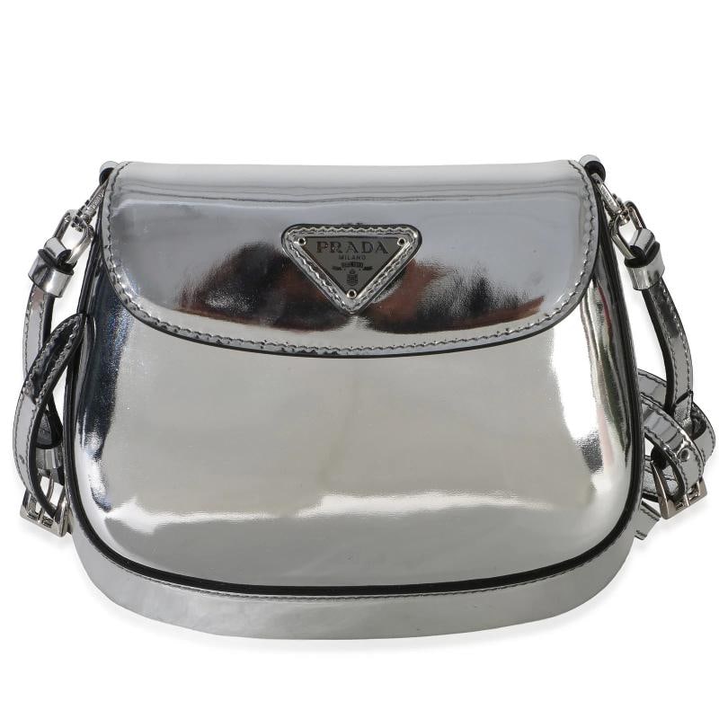 Prada Argento Spazzolato Mini Cleo Flap Bag: Condition: Pre-owned - Good,Dimensions: 6.75 x 6 x .75,Handbag Accessories: Dustbag;Removable Strap,Bag Width: 6.75 in,Bag Depth: 0.75 in,Bag Height: 6 in,Department: Unisex,Style: Crossbody Bag;Eveni