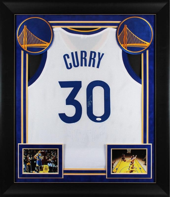 Stephen Curry Signed & Custom Framed Pro Style Jersey (JSA): Player: Stephen Curry,Product: Jersey,Original/Reprint: Original,Autograph Authentication: JSA,Team: Golden State Warriors,PRODUCT_COA: JSA,PRODUCT_SIGNED_BY_BRAND: Golden State Warriors,PRODUCT_SIGNE