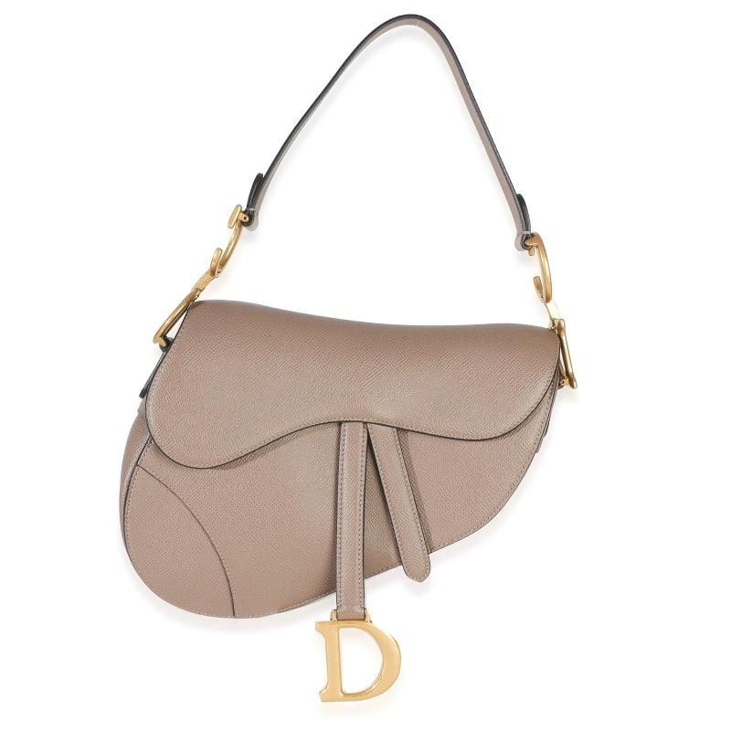 Christian Dior Taupe Grained Calfskin Medium Saddle Bag: Condition: Pre-owned - Good,Dimensions: 12 x 8.5 x 2.75,Handbag Accessories: Dustbag,Bag Width: 12 in,Bag Depth: 2.75 in,Bag Height: 8.5 in,Department: Unisex,Style: Shoulder Bag,Material: